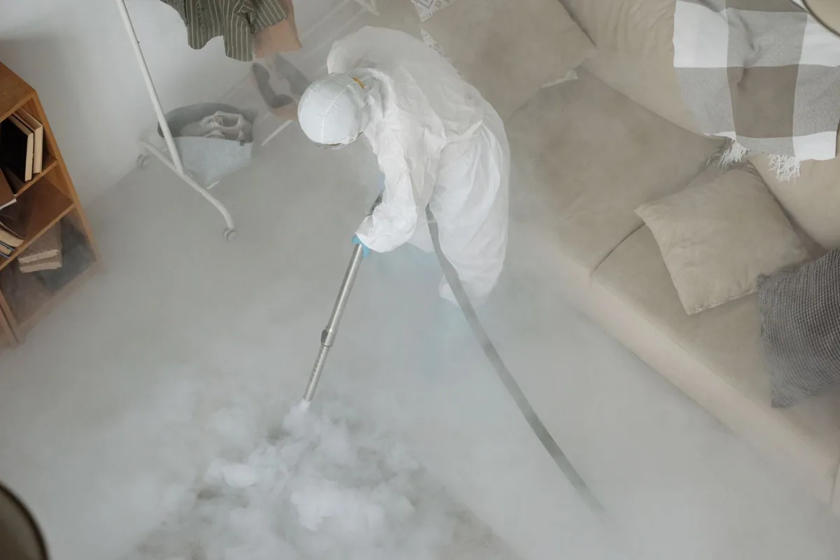 Biohazard cleanup technician in protective equipment, Brewery District, Columbus, OH